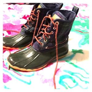 Sperry duck boots in a hunter green plaid.